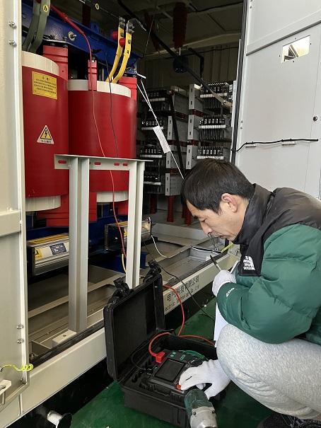 A quality control inspector at ORION RESISTOR is performing insulation testing on a 3.3KV neutral  grounding resistor cabinet.